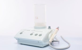 Microsuction ear wax removal machine on a plain background
